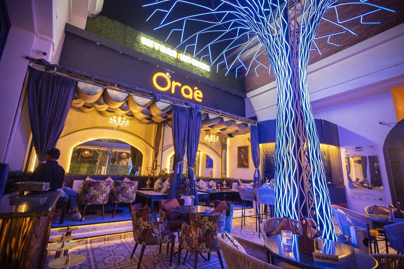 Orae Skybar | Kitchen interior with illuminated feature tree and lounge seating